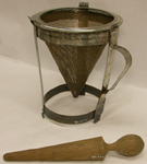 a%20wooden%20and%20metal%20sieve%20and%20masher